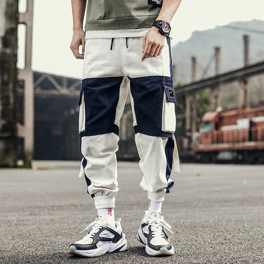 Person wearing a two-tone cargo pants with a blurred background