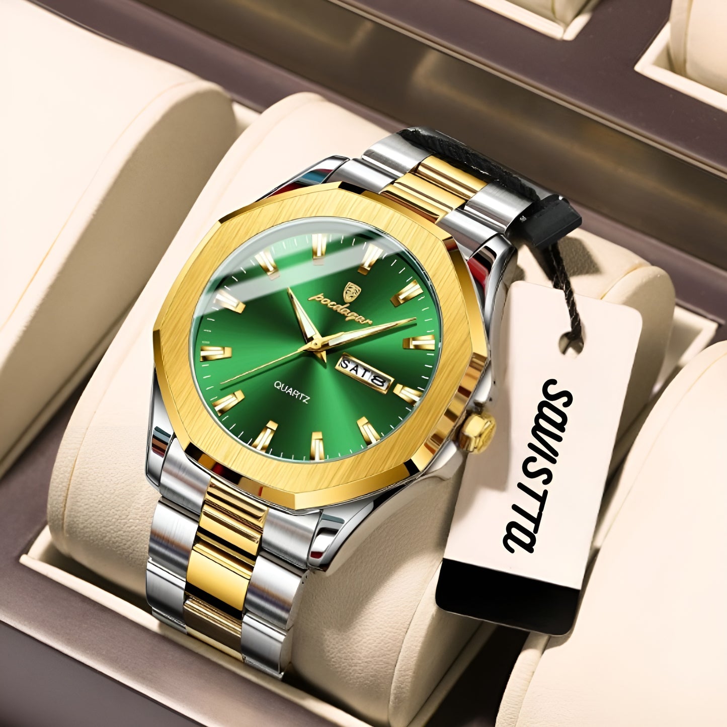 Luxury watch with green face and gold accents on a white cushion, brand tag visible