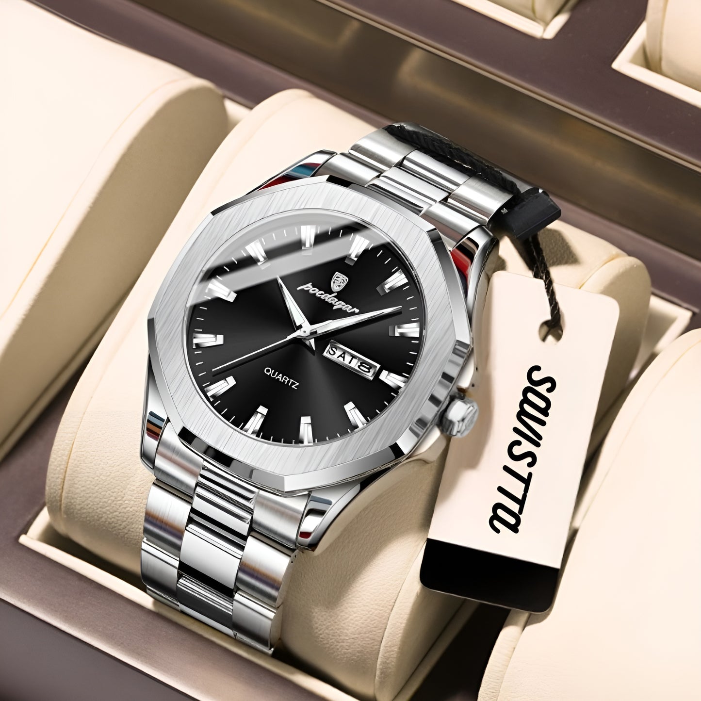 Silver watch with black face in a display case, featuring a visible brand tag.