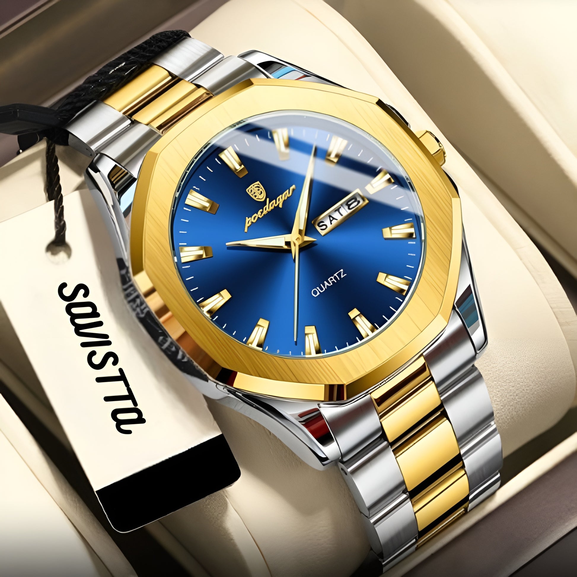 Luxury watch with blue dial and gold and silver band on a white surface