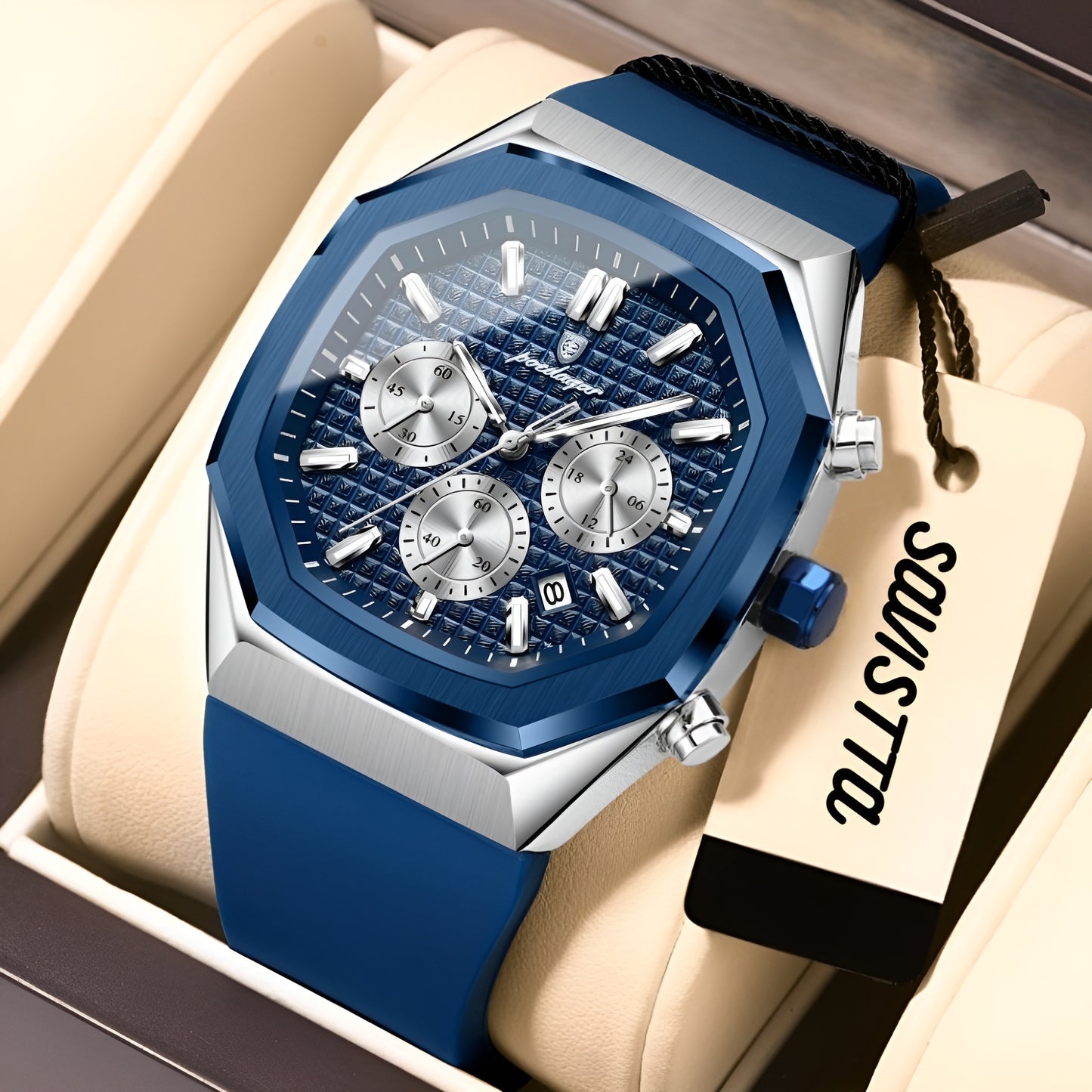 Blue and silver watch with a visible brand tag on a beige cushion