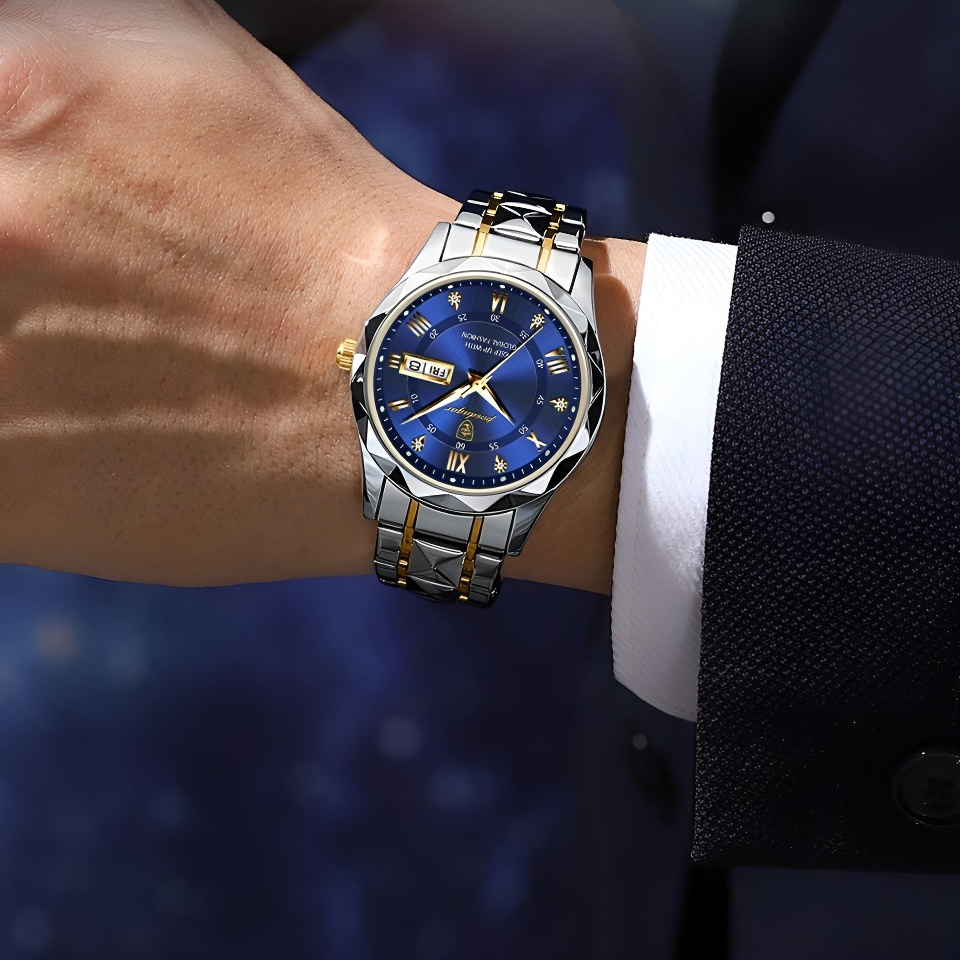 Luxury watch with blue face and silver and gold accents on a wrist.