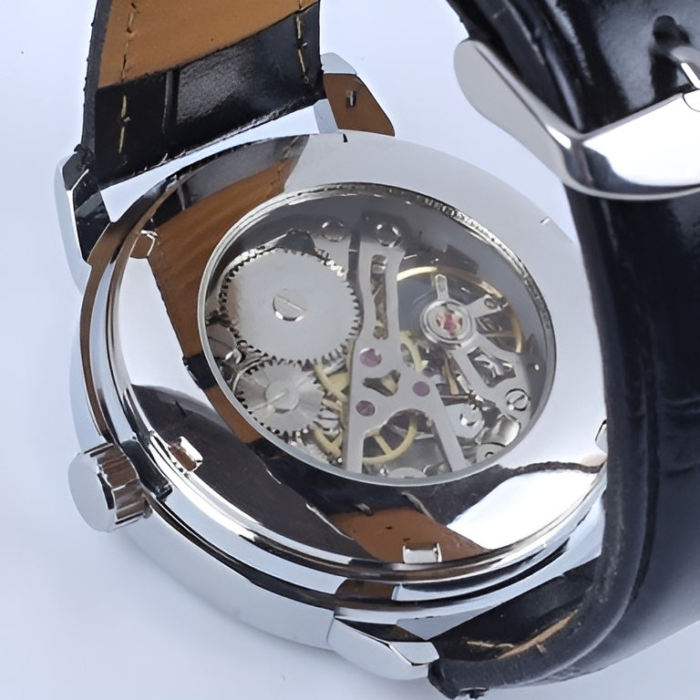 Close-up of a mechanical watch with visible gears on a white background