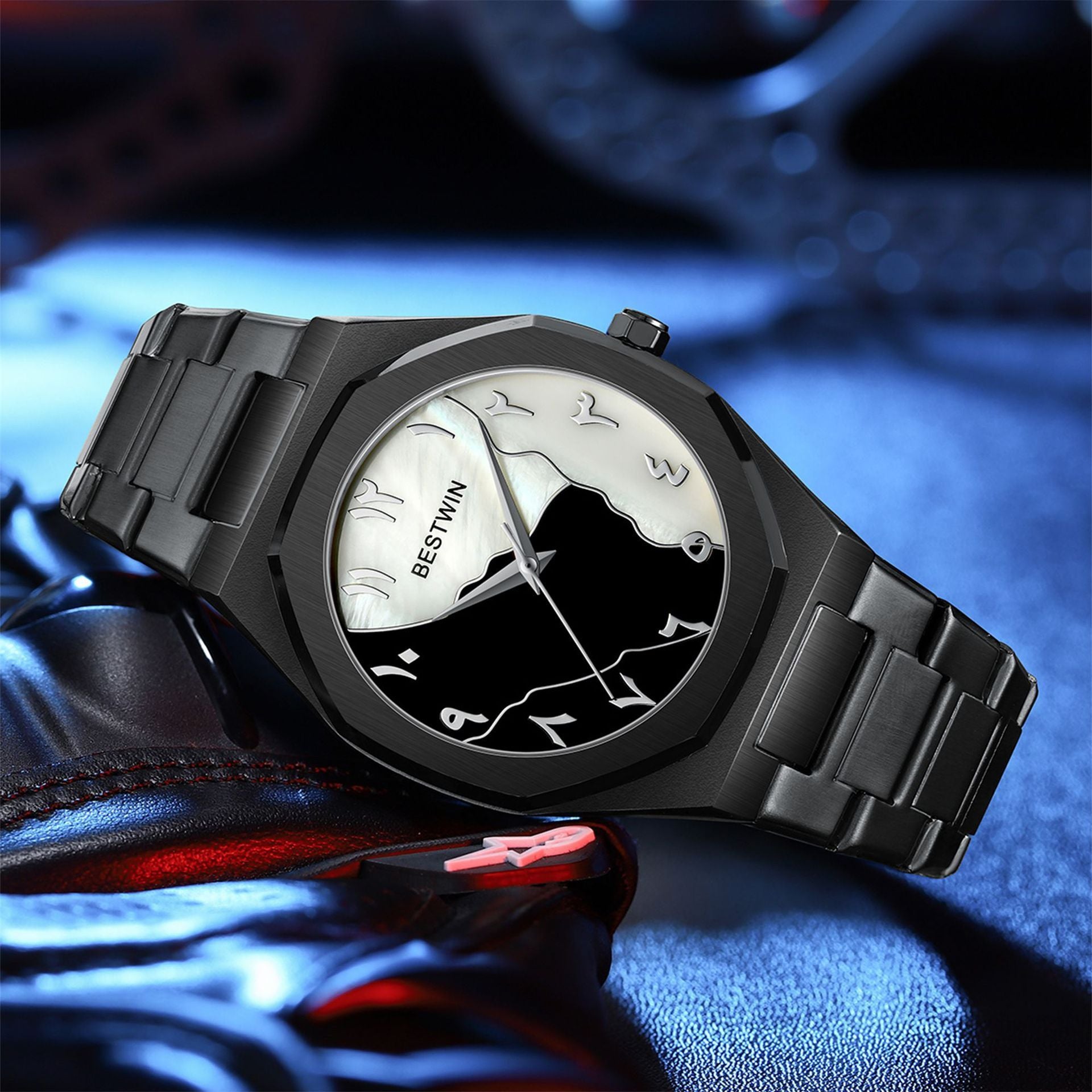 Black wristwatch with a unique face design on a reflective surface